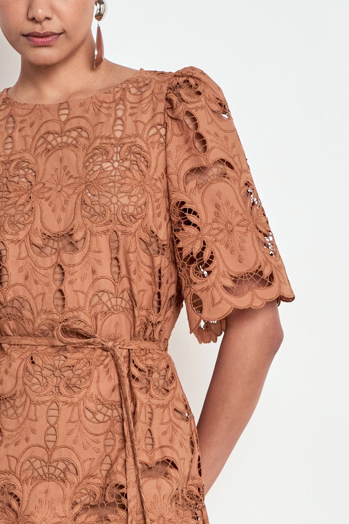 ZOE KRATZMANN GUIDE DRESS TRUFFLE - A rust-brown lace midi dress with short puff sleeves and a self-tie waist.