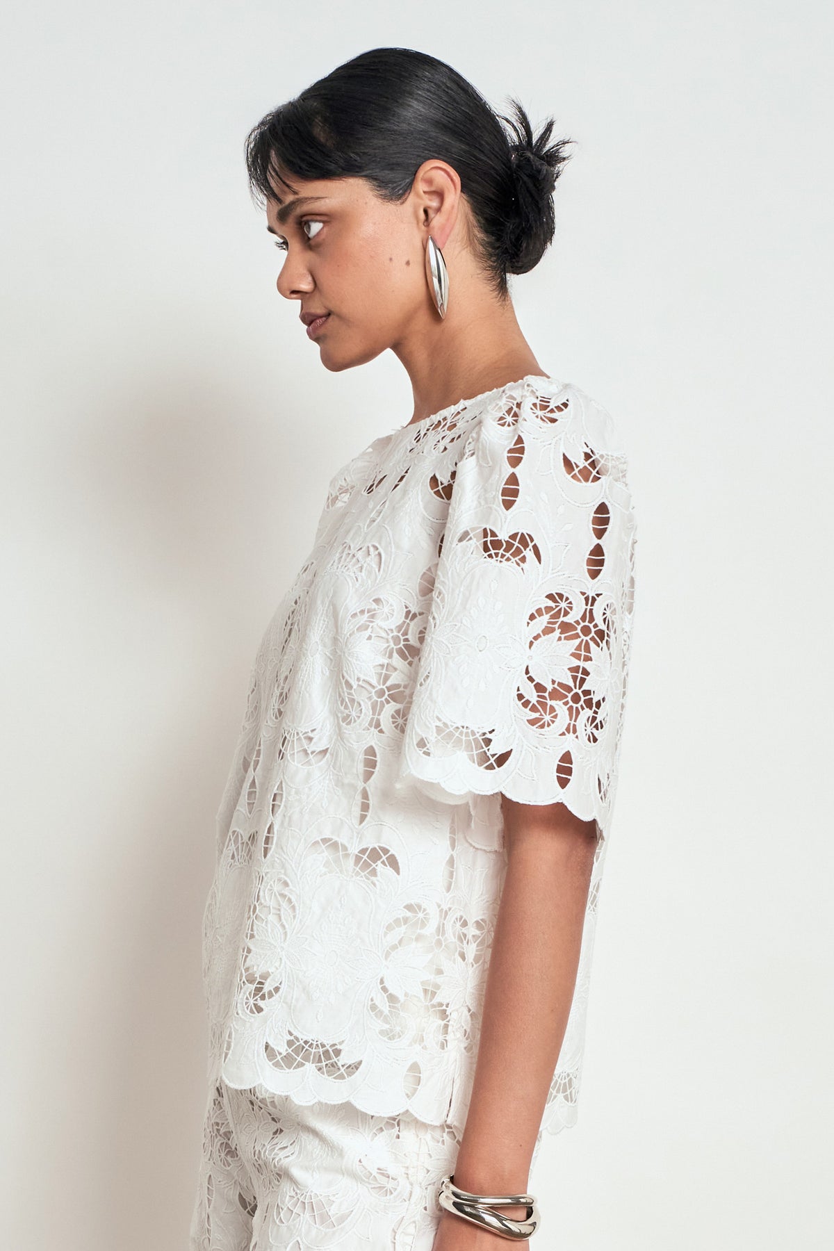 ZOE KRATZMANN RESOLVE TOP white lace blouse with short flutter sleeves and a scalloped hem
