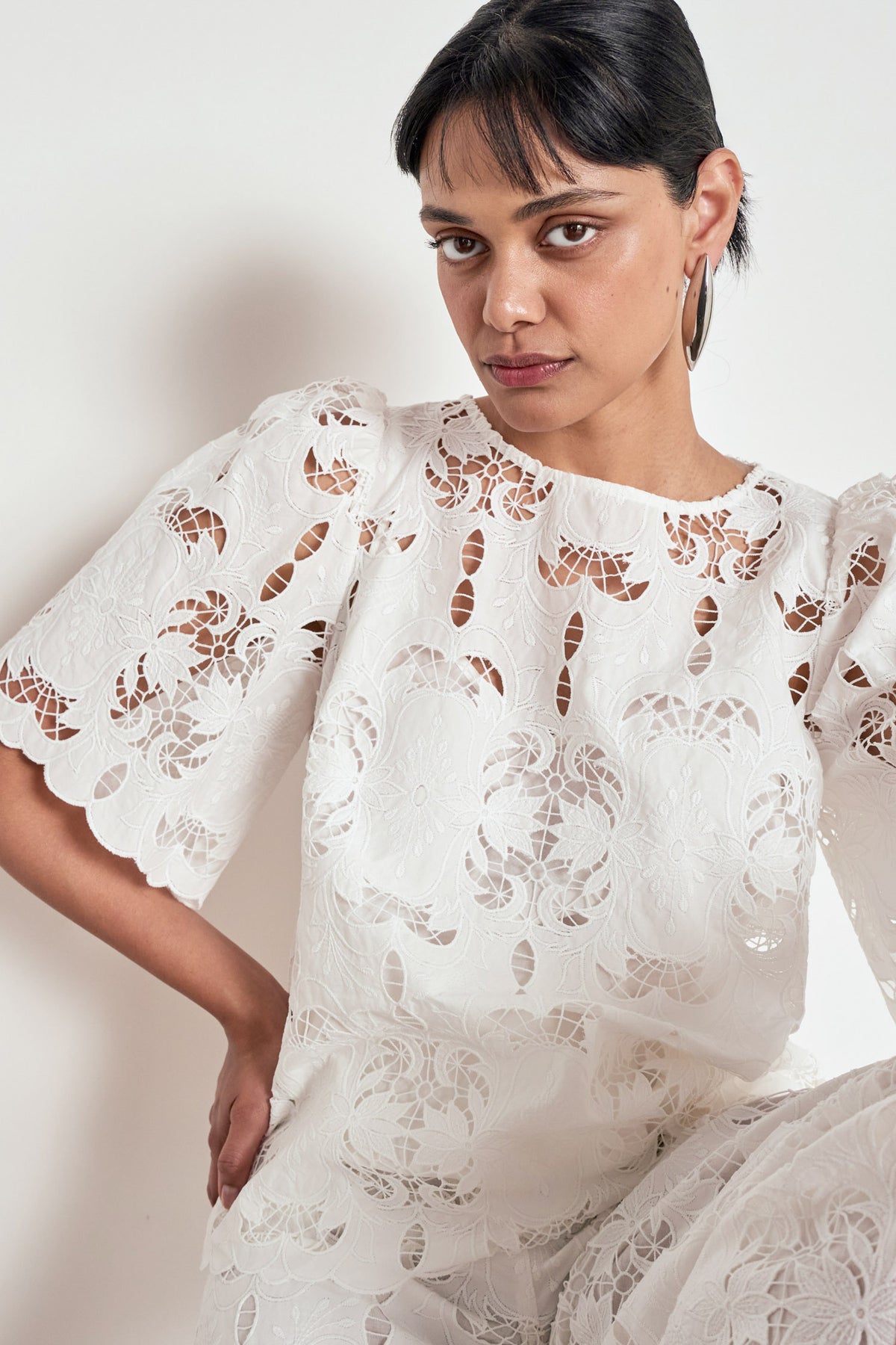 ZOE KRATZMANN RESOLVE TOP white lace blouse with short flutter sleeves and a scalloped hem