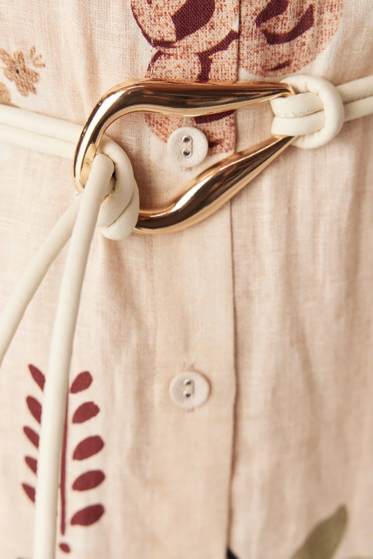Cable tie belt with sculptural gold buckle