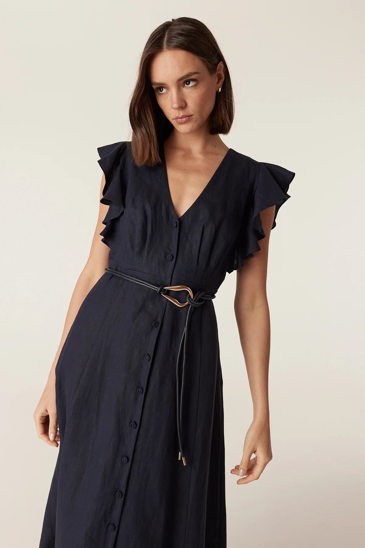 Cable tie belt with sculptural gold buckle