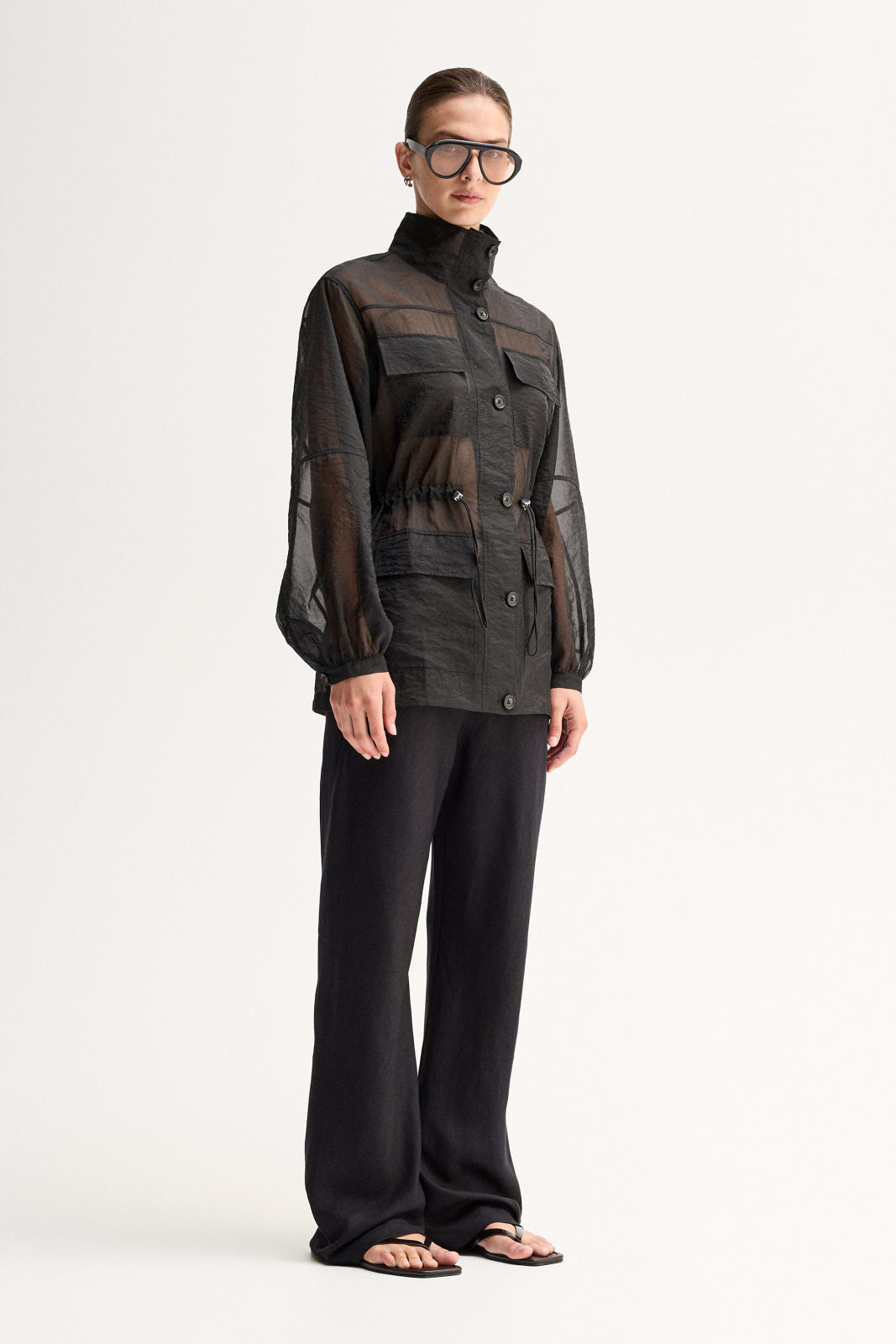 ELKA COLLECTIVE PERRI SHIRT BLACK SHIRT SHEER SHIRT ORGANZA SHIRT SHEER BLOUSE LIGHTWEIGHT SHIRT UTILITY SHIRT BUTTON SHIRT LONG SLEEVE HIGH NECK STATEMENT SHIRT MODERN SHIRT DESIGNER STYLE CONTEMPORARY FASHION MINIMAL STYLE SMART CASUAL ELEVATED BASICS EVERYDAY STYLE LAYERING PIECE BLACK CLOTHING WOMENS SHIRT WOMENS FASHION FASHION SHIRT POCKET SHIRT DRAWSTRING WAIST SEMI SHEER OVERSIZED FIT PREMIUM QUALITY TRANSITIONAL STYLE RESORT WEAR EVENING STYLE CHIC STYLE