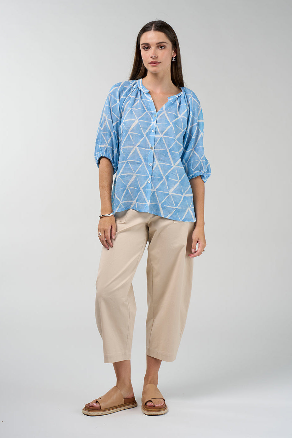 Prism button-down blouse in sky blue and white geometric print with gathered neckline and puff sleeves
