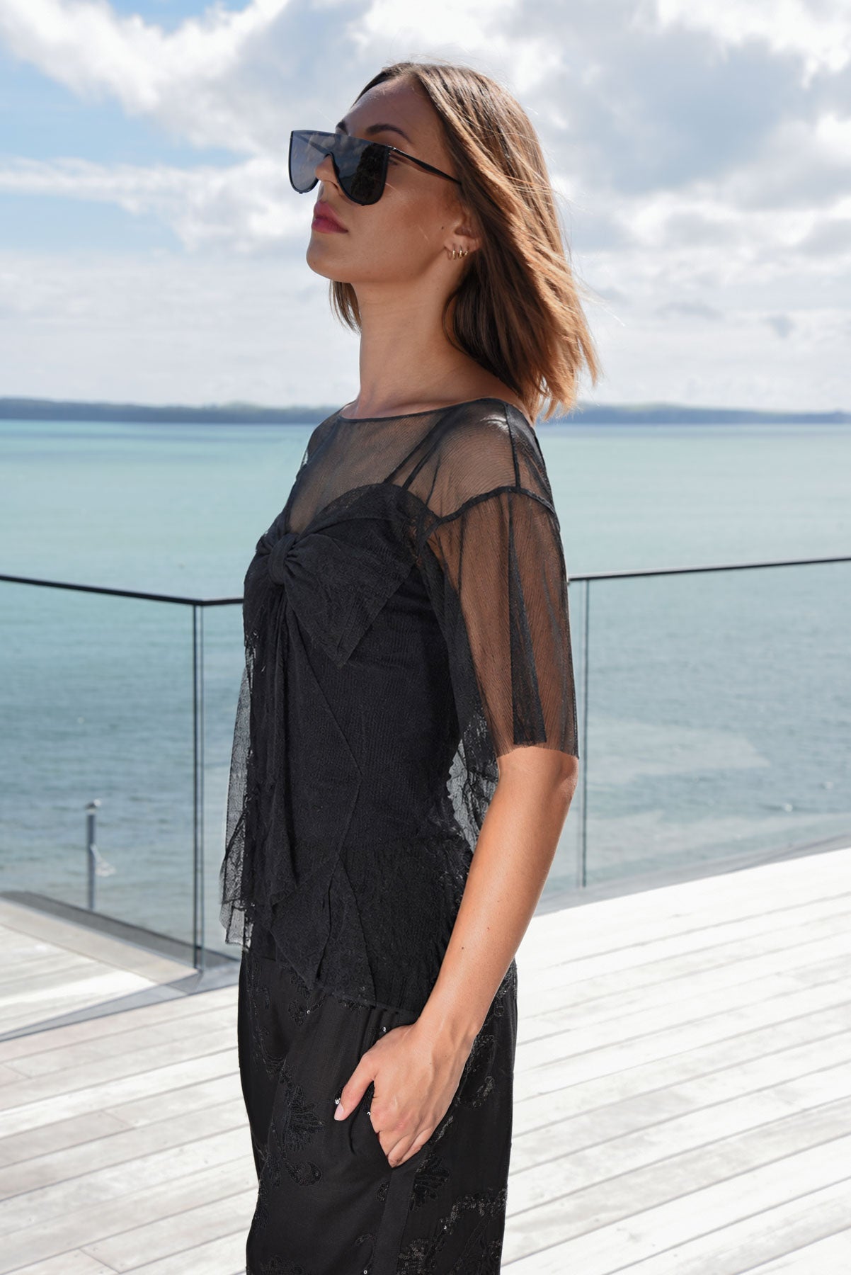 TRELISE COOPER THATS HOW WE BOW TOP BLACK SHEER TEE
