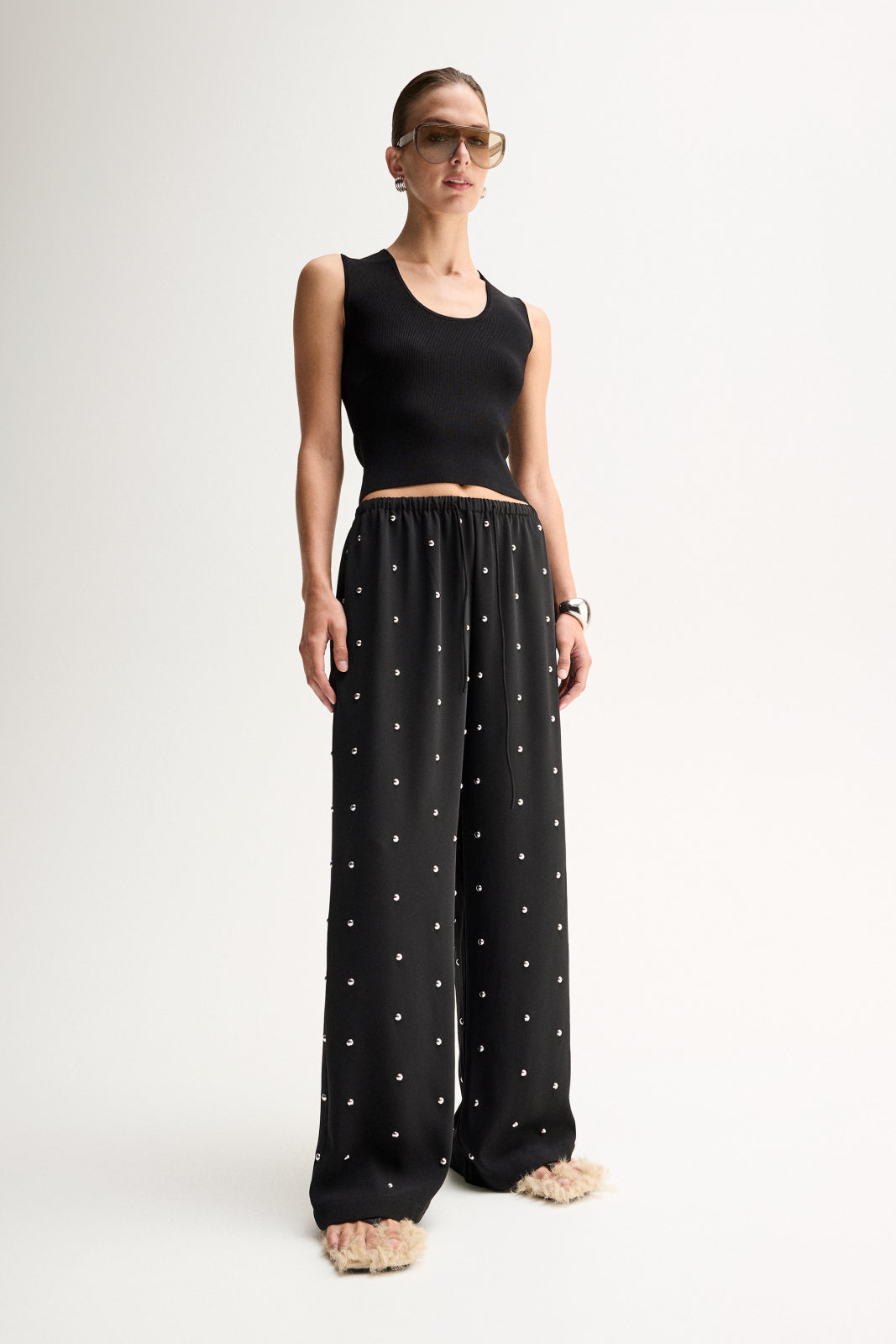 ELKA COLLECTIVE OLYMPIA PANT BLACK WIDE LEG PANTS BLACK WIDE LEG TROUSERS EMBELLISHED BLACK PANTS EMBELLISHED TROUSERS STUDDED BLACK PANTS RHINESTONE PANTS CRYSTAL EMBELLISHED TROUSERS BLACK FLOWY PANTS RELAXED FIT TROUSERS WIDE LEG TROUSERS WOMEN HIGH WAISTED BLACK PANTS ELASTICATED WAIST PANTS DRAWSTRING TROUSERS STATEMENT TROUSERS EVENING TROUSERS ELEGANT BLACK PANTS LUXURY BLACK TROUSERS WOMEN'S DESIGNER TROUSERS CONTEMPORARY WOMEN'S FASHION CHIC BLACK TROUSERS DRESSY WIDE LEG PANTS BLACK STATEMENT PANT
