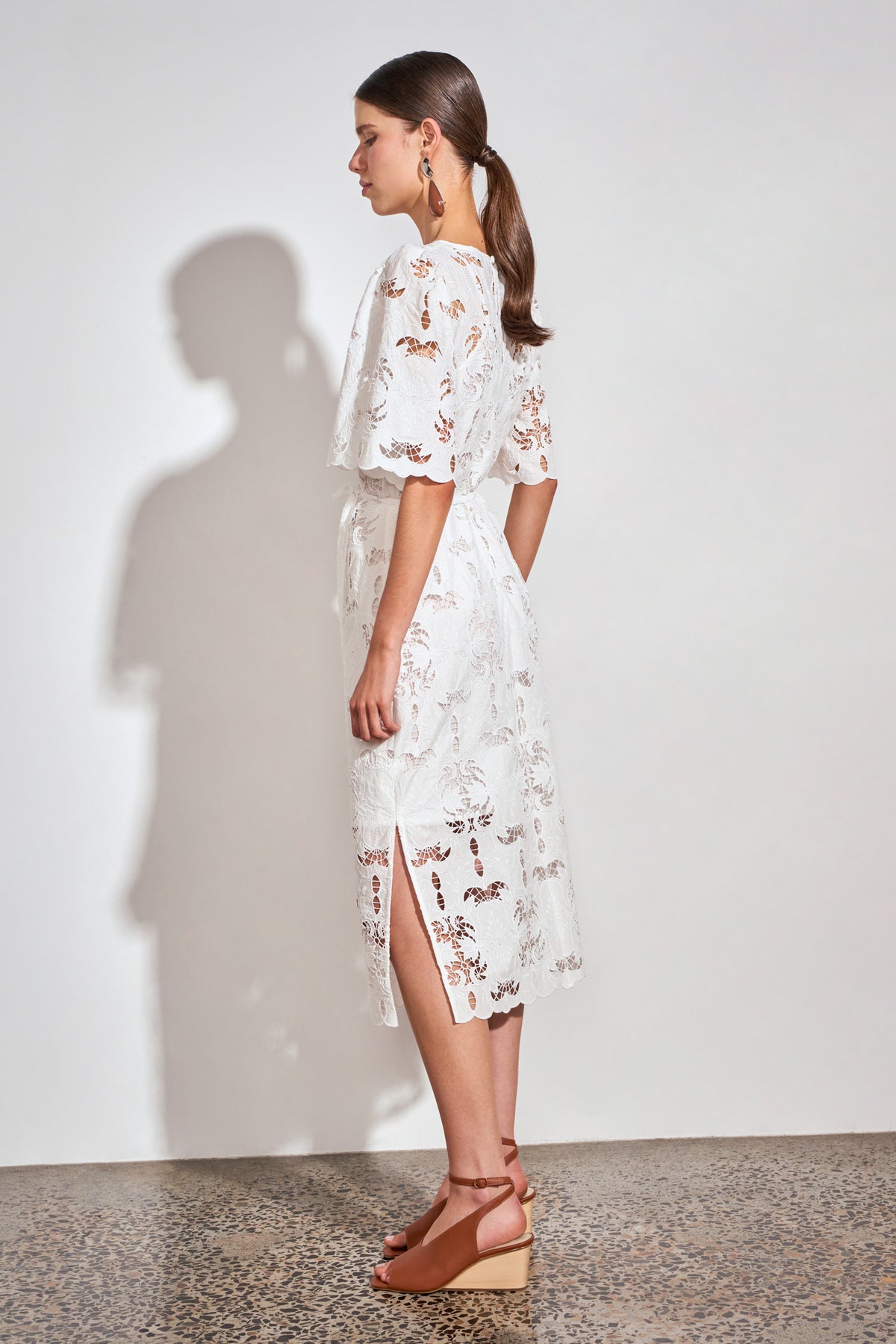 ZOE KRATZMANN GUIDE DRESS ALABASTER - A white midi dress with eyelet embroidery detail and puff sleeves.