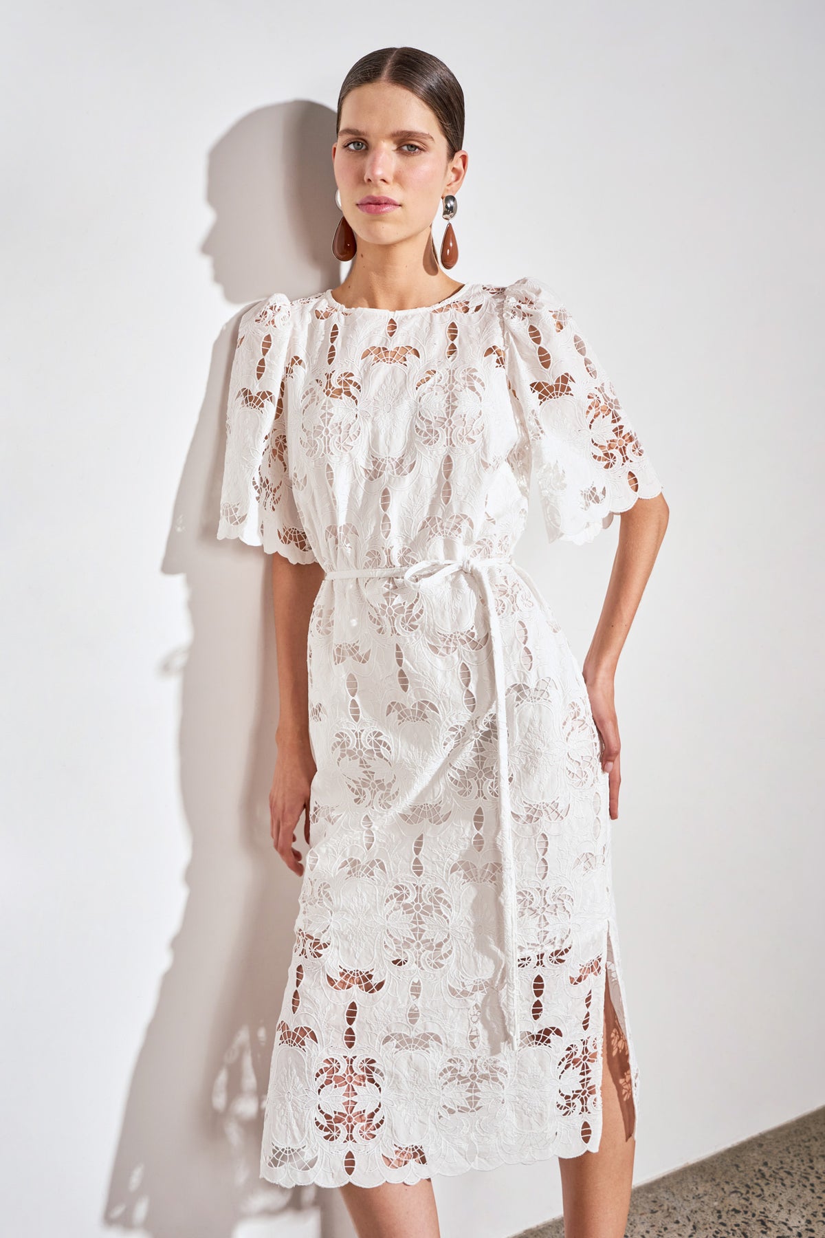 ZOE KRATZMANN GUIDE DRESS ALABASTER - A white midi dress with eyelet embroidery detail and puff sleeves.