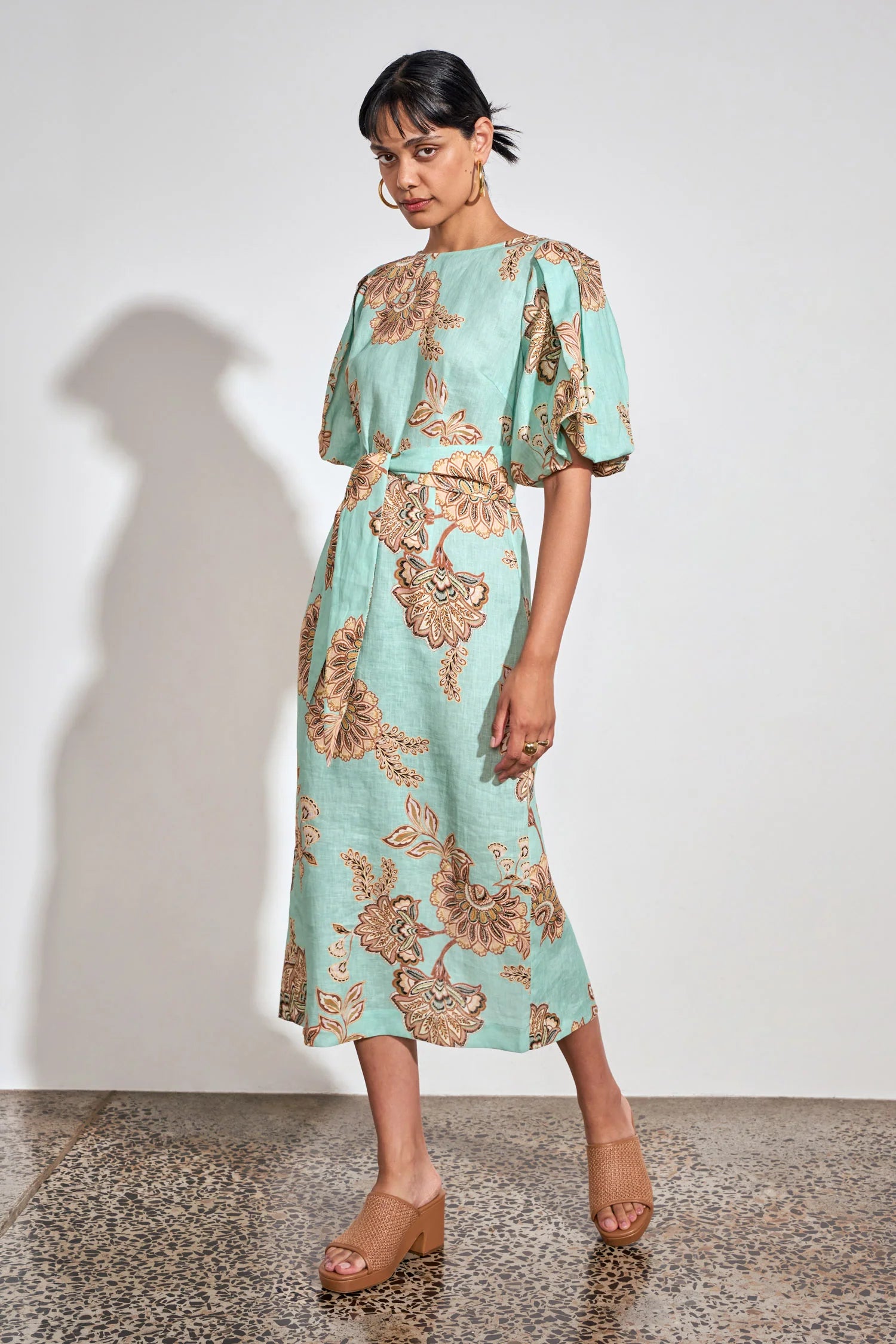 ZOE KRATSMANN COAST DRESS, A MIDI LENGTH MINT DRESS WITH A FLORAL PATTERN, PUFF SLEEVES AND A TIE AT THE WAIST
