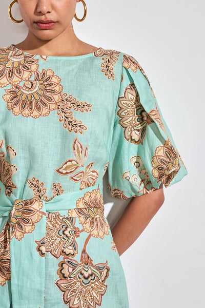 ZOE KRATSMANN COAST DRESS, A MIDI LENGTH MINT DRESS WITH A FLORAL PATTERN, PUFF SLEEVES AND A TIE AT THE WAIST