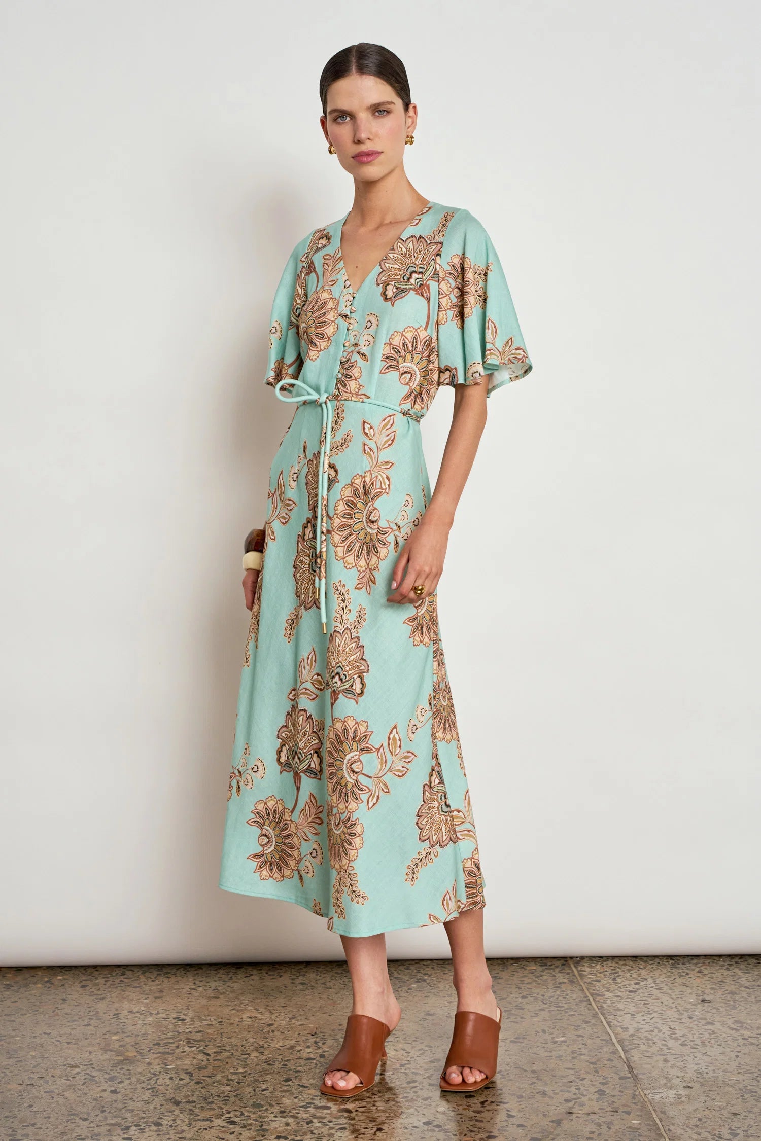 ZOE KRATSMANN PREMIER DRESS A MINT MAXI DRESS WITH A FLORAL PRINT, FLOATY SLEEVES, BUTTONS ALONG THE CLEAVAGE AND A TIE AT THE WAIST