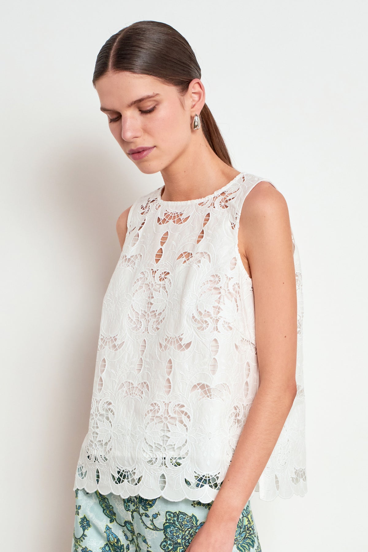 ZOE KRATZMANN GARNER TOP ALABASTER  - A sleeveless white lace top with a scalloped hem and sheer flutter sleeves