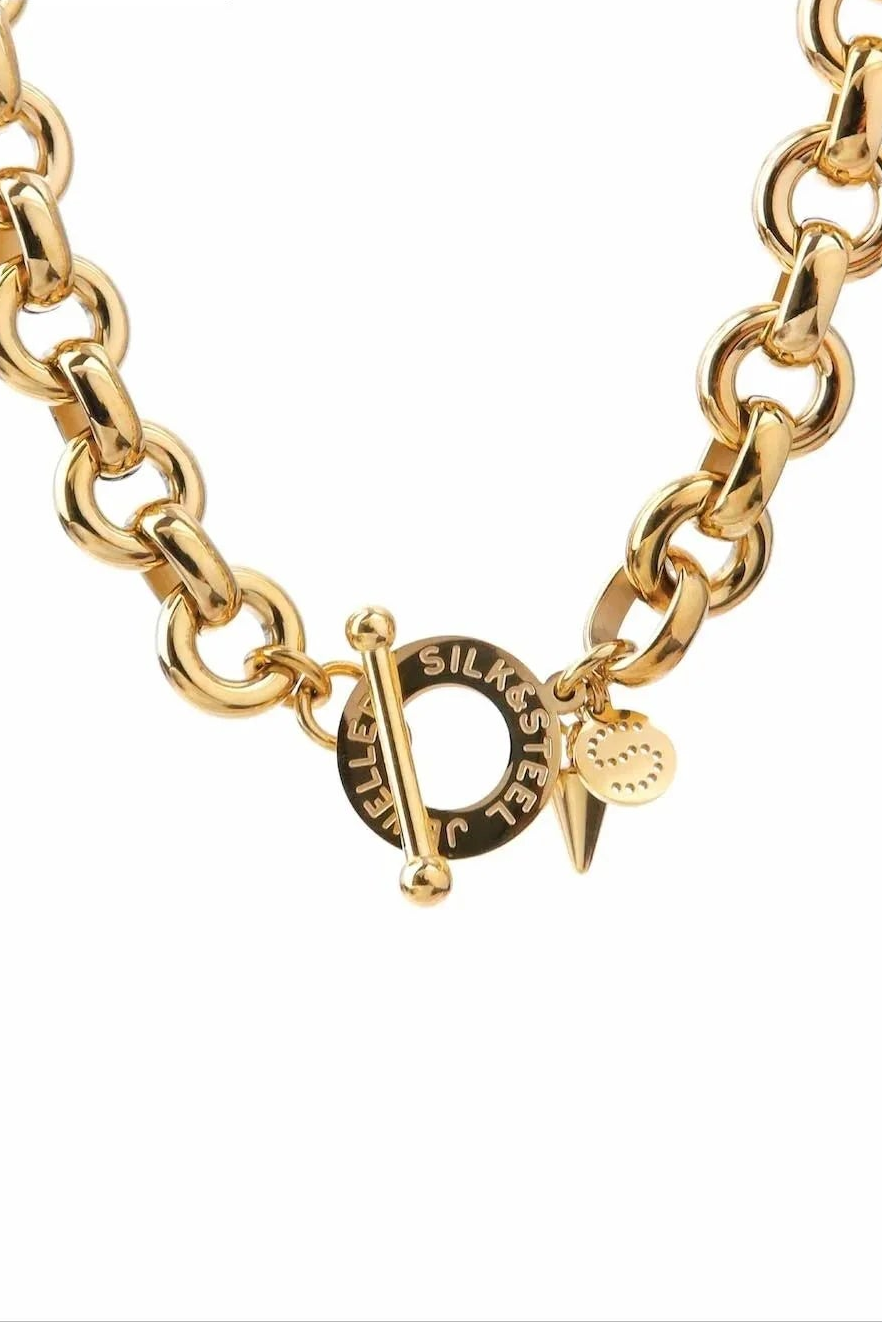 SILK AND STEEL HEIRLOOM NECKLACE GOLD NECKLACE CHUNKY CHAIN LINK CHAIN CHAIN NECKLACE TOGGLE CLASP T BAR CLASP STATEMENT NECKLACE LAYERING NECKLACE CHARM NECKLACE GOLD JEWELLERY GOLD CHAIN HEART CHARM SPIKE CHARM DISC CHARM CHUNKY JEWELLERY BOLD JEWELLERY MODERN JEWELLERY CONTEMPORARY STYLE EVERYDAY JEWELLERY LUXE STYLE MINIMAL STYLE TREND JEWELLERY WOMENS JEWELLERY LAYERING PIECE GIFT IDEA STAINLESS STEEL POLISHED FINISH PREMIUM JEWELLERY FASHION JEWELLERY GOLD ACCESSORIES