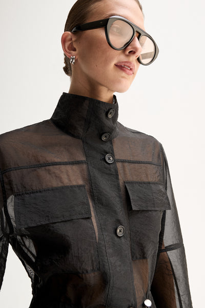 ELKA COLLECTIVE PERRI SHIRT BLACK SHIRT SHEER SHIRT ORGANZA SHIRT SHEER BLOUSE LIGHTWEIGHT SHIRT UTILITY SHIRT BUTTON SHIRT LONG SLEEVE HIGH NECK STATEMENT SHIRT MODERN SHIRT DESIGNER STYLE CONTEMPORARY FASHION MINIMAL STYLE SMART CASUAL ELEVATED BASICS EVERYDAY STYLE LAYERING PIECE BLACK CLOTHING WOMENS SHIRT WOMENS FASHION FASHION SHIRT POCKET SHIRT DRAWSTRING WAIST SEMI SHEER OVERSIZED FIT PREMIUM QUALITY TRANSITIONAL STYLE RESORT WEAR EVENING STYLE CHIC STYLE