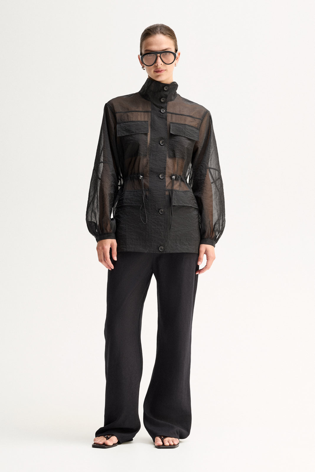 ELKA COLLECTIVE PERRI SHIRT BLACK SHIRT SHEER SHIRT ORGANZA SHIRT SHEER BLOUSE LIGHTWEIGHT SHIRT UTILITY SHIRT BUTTON SHIRT LONG SLEEVE HIGH NECK STATEMENT SHIRT MODERN SHIRT DESIGNER STYLE CONTEMPORARY FASHION MINIMAL STYLE SMART CASUAL ELEVATED BASICS EVERYDAY STYLE LAYERING PIECE BLACK CLOTHING WOMENS SHIRT WOMENS FASHION FASHION SHIRT POCKET SHIRT DRAWSTRING WAIST SEMI SHEER OVERSIZED FIT PREMIUM QUALITY TRANSITIONAL STYLE RESORT WEAR EVENING STYLE CHIC STYLE