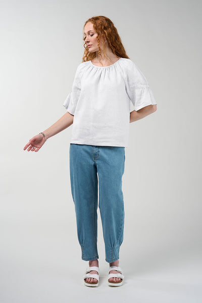 Cove linen blouse in silk white with gathered round neckline and flared sleeves