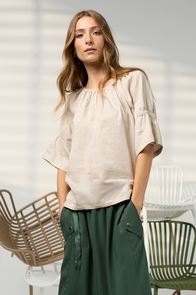 Cove linen blouse in natural with gathered neckline and flared sleeves