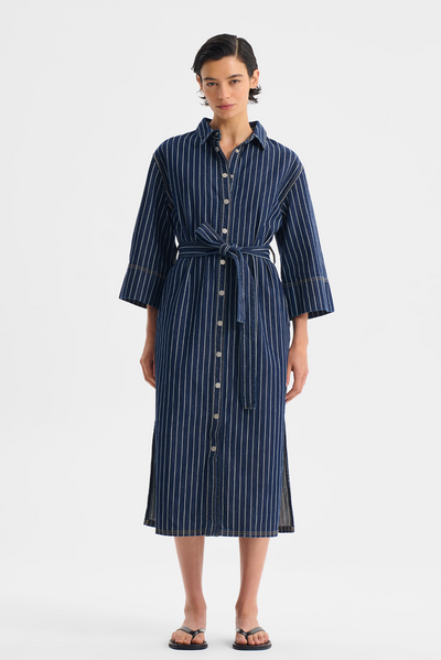 WYATT DENIM DRESS Woman wearing a blue striped dress on a white background