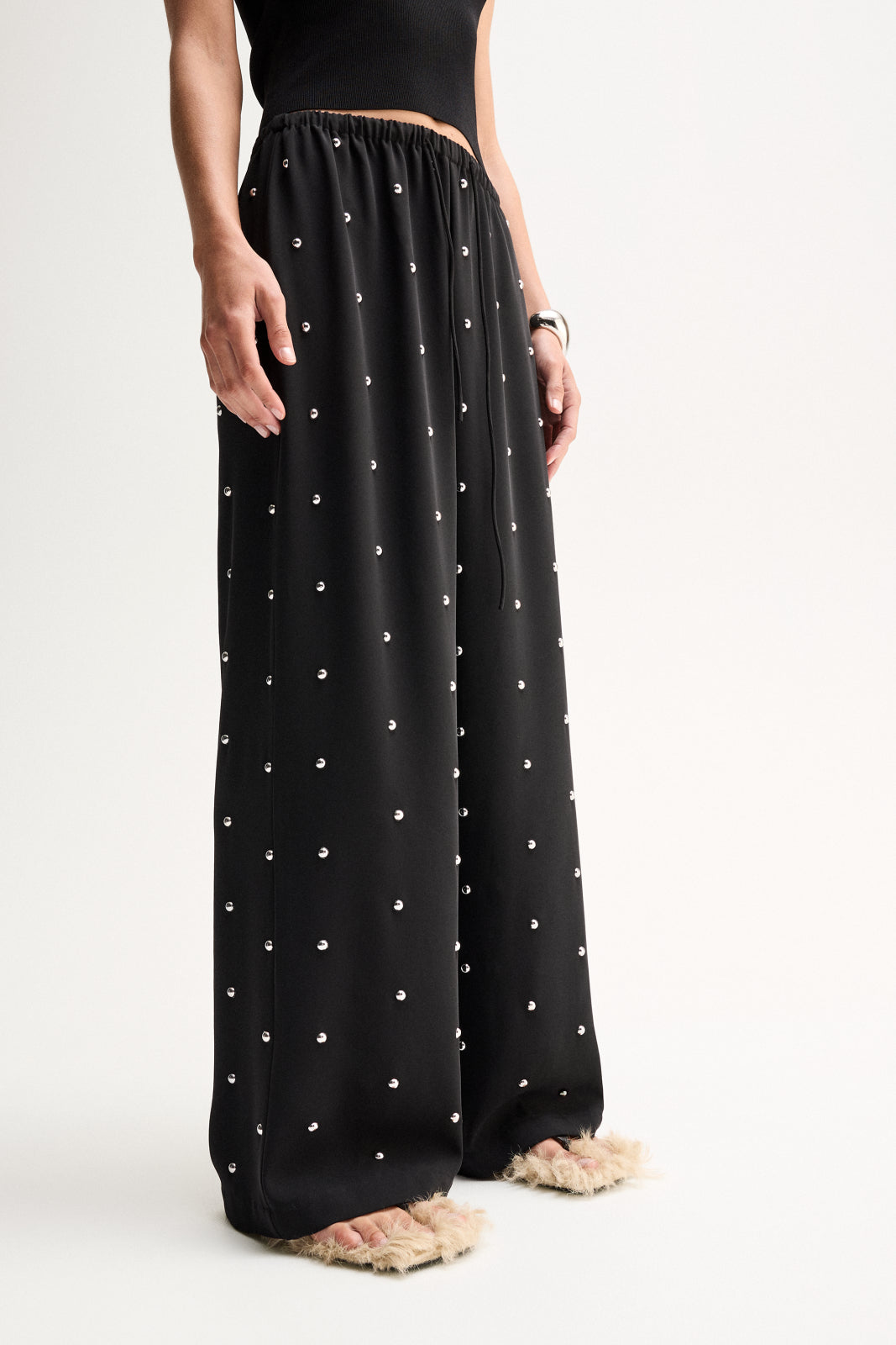 ELKA COLLECTIVE OLYMPIA PANT BLACK WIDE LEG PANTS BLACK WIDE LEG TROUSERS EMBELLISHED BLACK PANTS EMBELLISHED TROUSERS STUDDED BLACK PANTS RHINESTONE PANTS CRYSTAL EMBELLISHED TROUSERS BLACK FLOWY PANTS RELAXED FIT TROUSERS WIDE LEG TROUSERS WOMEN HIGH WAISTED BLACK PANTS ELASTICATED WAIST PANTS DRAWSTRING TROUSERS STATEMENT TROUSERS EVENING TROUSERS ELEGANT BLACK PANTS LUXURY BLACK TROUSERS WOMEN'S DESIGNER TROUSERS CONTEMPORARY WOMEN'S FASHION CHIC BLACK TROUSERS DRESSY WIDE LEG PANTS BLACK STATEMENT PANT