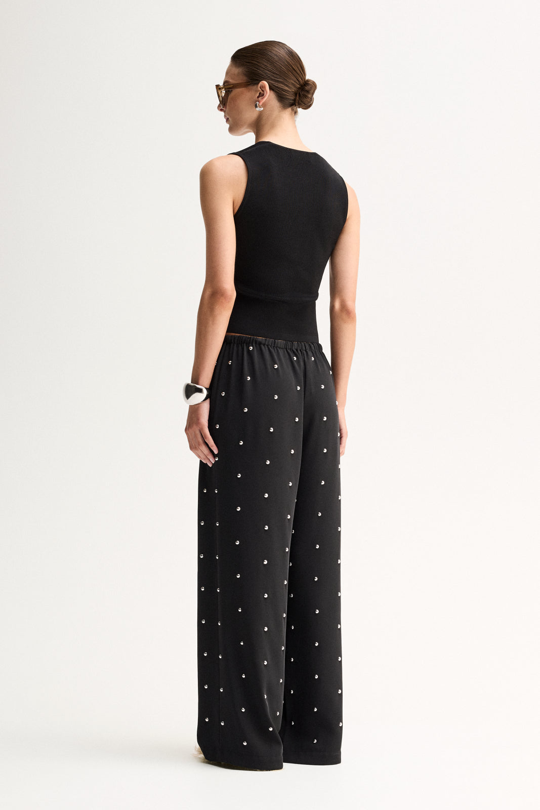 ELKA COLLECTIVE OLYMPIA PANT BLACK WIDE LEG PANTS BLACK WIDE LEG TROUSERS EMBELLISHED BLACK PANTS EMBELLISHED TROUSERS STUDDED BLACK PANTS RHINESTONE PANTS CRYSTAL EMBELLISHED TROUSERS BLACK FLOWY PANTS RELAXED FIT TROUSERS WIDE LEG TROUSERS WOMEN HIGH WAISTED BLACK PANTS ELASTICATED WAIST PANTS DRAWSTRING TROUSERS STATEMENT TROUSERS EVENING TROUSERS ELEGANT BLACK PANTS LUXURY BLACK TROUSERS WOMEN'S DESIGNER TROUSERS CONTEMPORARY WOMEN'S FASHION CHIC BLACK TROUSERS DRESSY WIDE LEG PANTS BLACK STATEMENT PANT